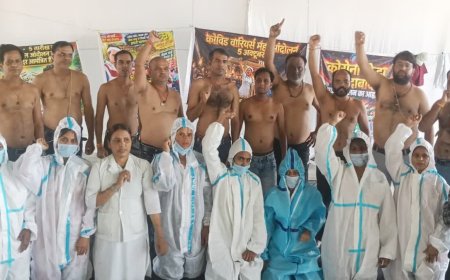 कोरोना योद्धाओं का अनोखा प्रदर्शन, महिला स्वास्थ्यकर्मियों ने पहनी PPE किट तो पुरुष हुए अर्धनग्न